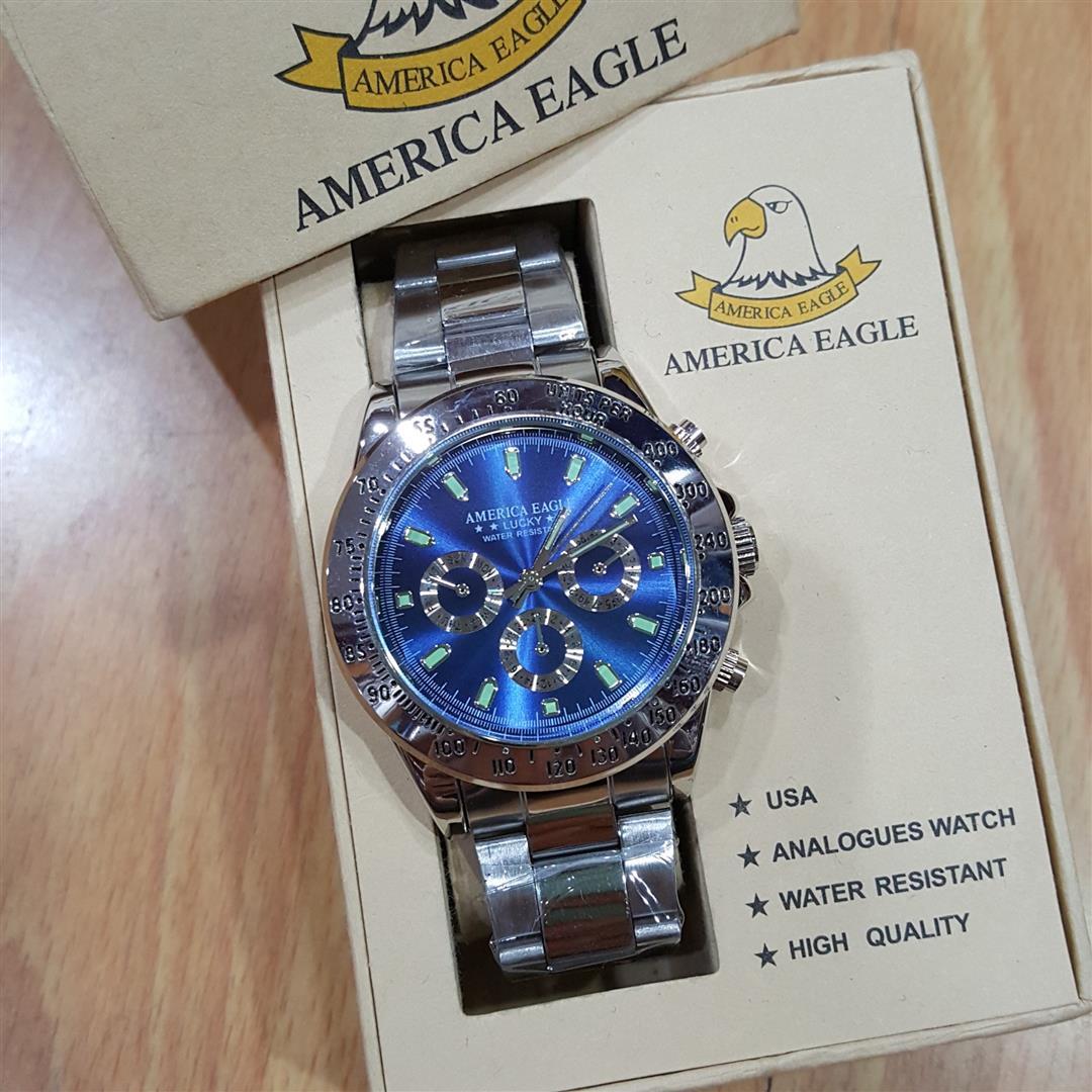America Eagle นาฬิกาข้อมือผู้ชายสแตนเลสเงิน เข็ม3วง ฟรีกล่องแบรนด์สุดหรู America Eagle นาฬิกาข้อมือผู้ชายสแตนเลสเงิน เข็ม3วง ฟรีกล่องแบรนด์สุดหรู