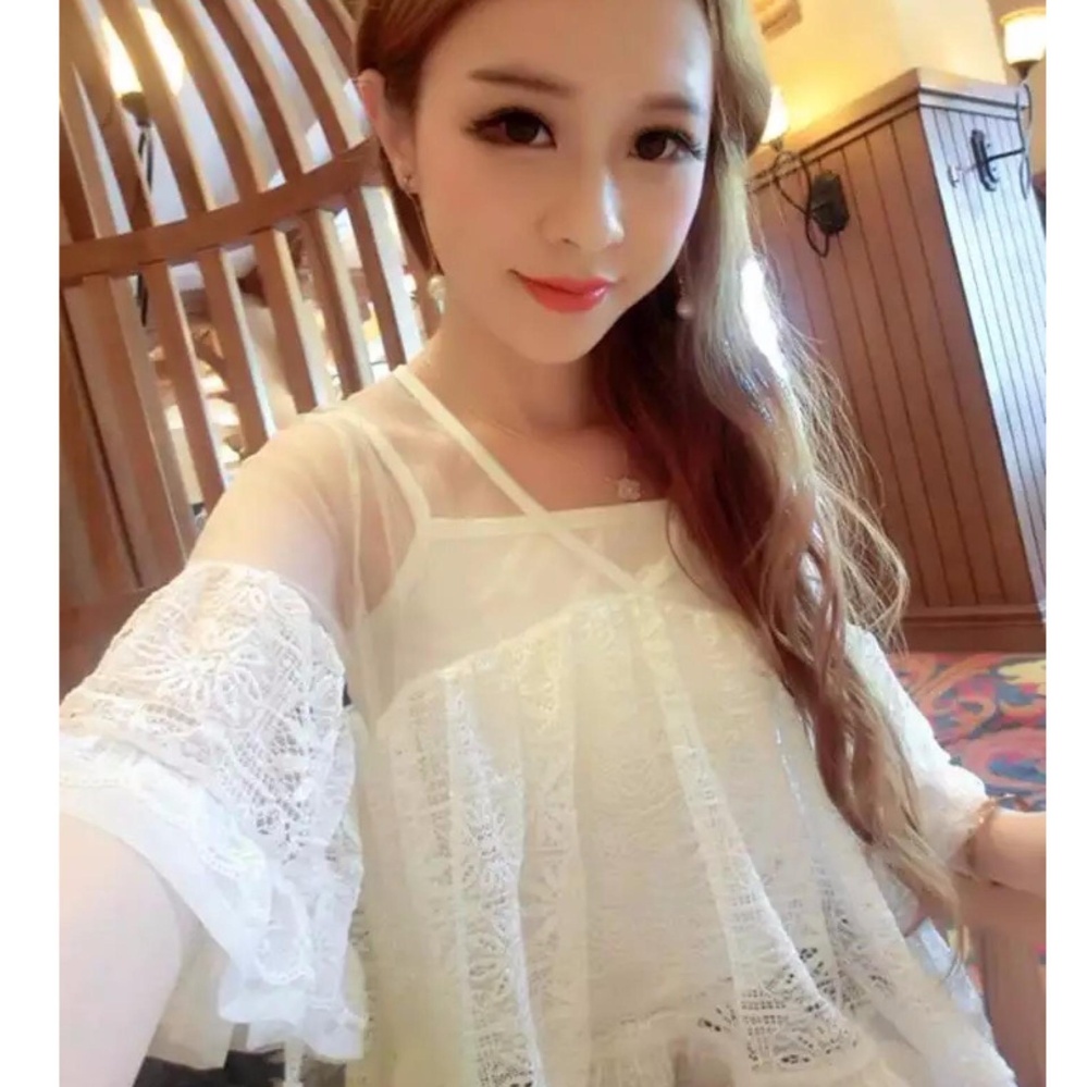 แฟชั่นเกาหลีเสื้อลูกไม้หน้าสั้นหลังยาวชายระบาย X-1สีขาว