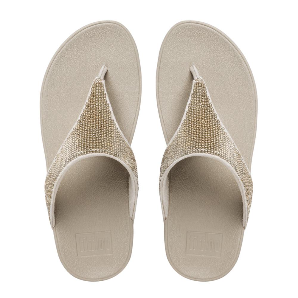 FITFLOP รองเท้าแตะหญิงรุ่น ELEOTRA MICRO TOE POST สี Pale Gold