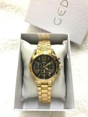 นาฬิา GEDI ของแท้ งานเกาหลี หน้าปัดสไตล์ MK สุดฮิต ขายดีมาก ตัวเรือนสีทอง หน้าปัดดำ -สินค้าของแท้ 100% กันน้ำได้ (มีเก็บเงินปลายทาง)