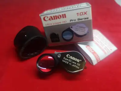 Canon Ultra HD Pro Series 10X สีเงิน เลนส์แก้วสองชั้น ส่องชัดสบายตา แถมฟรีซองหนังตรงรุ่น