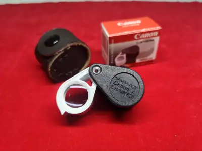 กล้องส่องพระ/ส่องเพรช Canon A.S.H.1989628 สีดำขาว เลนส์แก้วสามชั้น Multicoat 10X18MM แถมฟรีซองหนังวัวแท้สวยๆตรงรุ่น