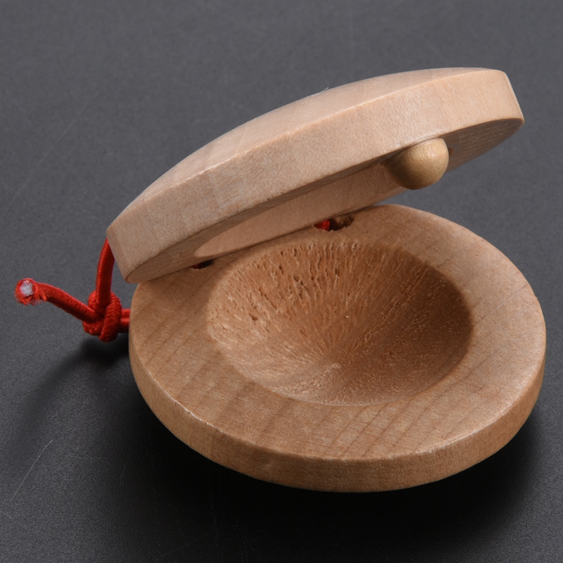 A pair of wooden flamenco musical instrument of wood color